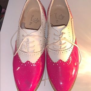 Pink and white Wing Tip shoes